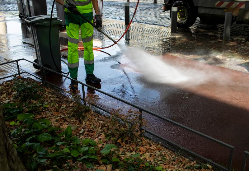 A team member from A Clear View Window Cleaning is cleaning the sidewalks in Stewartstown, PA