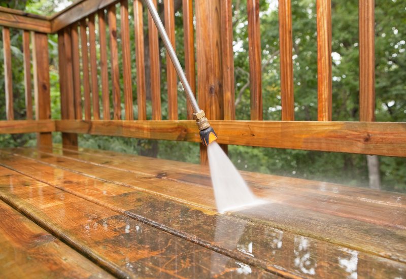 Professional residential deck cleaning in Stewartstown, PA, highlighting a freshly cleaned wooden deck.